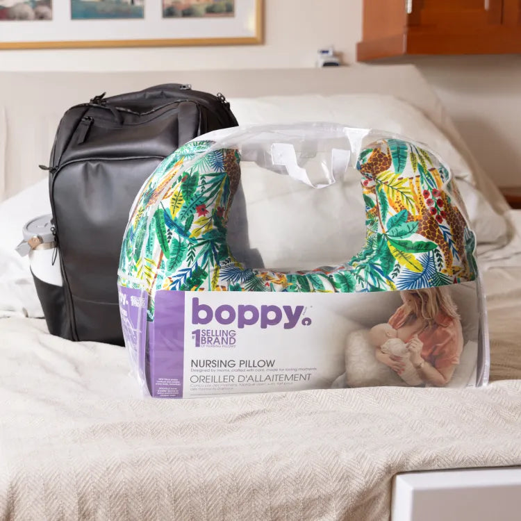 Boppy pillow in packaging  being gifted to new mother