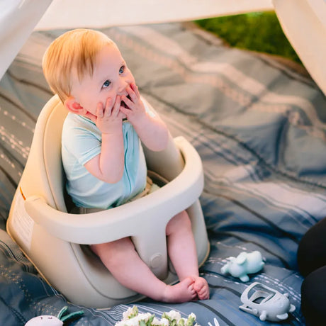 Baby sitting in the Boppy Proper Posture Baby Seat