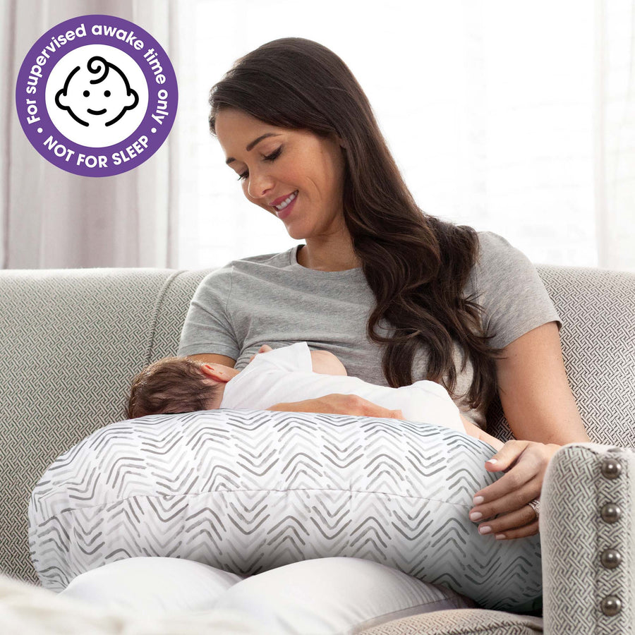 When should parents introduce pillows to their babies?